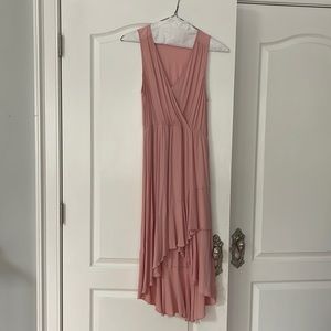 Dress up or dress down this sexy but sweet high low hem dress. Empire waist.